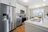 Apartment kitchen at Seasons at River View Apartments in Pleasant Prairie, Wisconsin with updated cabinetry and finishes.