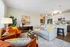 Living room at Seasons at River View Apartments in Pleasant Prairie, Wisconsin with an open layout.