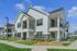 Resident building exterior at Seasons at Franklin Apartments in Franklin, Wisconsin featuring private entries and attached garage access.