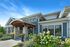 Clubhouse exterior at Seasons at Orchard Hills in Oak Creek, Wisconsin, featuring the main community building and surrounding landscaped areas.