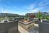 Outdoor gas firepit at Seasons at Orchard Hills in Oak Creek, Wisconsin, offering a shared gathering space with seating.