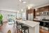 Apartment kitchen at Seasons at Orchard Hills in Oak Creek, Wisconsin, featuring updated finishes and functional storage.