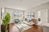 Living room at Seasons at Orchard Hills in Oak Creek, Wisconsin, offering an open layout with natural light.