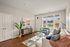 Living room at Seasons at Orchard Hills in Oak Creek, Wisconsin, offering an open layout with natural light.