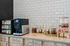 Complimentary coffee bar at Seasons at Franklin Apartments in Franklin, Wisconsin located within the clubhouse for resident use.