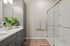 Bathroom at Seasons at Franklin Apartments in Franklin, Wisconsin featuring clean finishes and functional vanity space.
