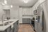 Kitchen at Seasons at Franklin Apartments in Franklin, Wisconsin featuring ample cabinet storage, updated appliances, and functional layout.