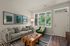 Living room at Seasons at Franklin Apartments in Franklin, Wisconsin offering open layouts and natural light.