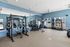 Fitness center at Seasons at Grafton Apartments in Grafton, Wisconsin equipped for a variety of workout routines.