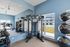 Fitness center at Seasons at Grafton Apartments in Grafton, Wisconsin equipped for a variety of workout routines.