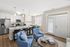 Living room at Seasons at Grafton Apartments in Grafton, Wisconsin featuring open layouts and comfortable living space.