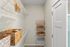Walk-in closet at Seasons at Grafton Apartments in Grafton, Wisconsin offering additional storage and organization space.