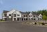 Resident building exterior at Seasons at Grafton Apartments in Grafton, Wisconsin showcasing community design and private entries.