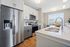 Apartment kitchen interior at Seasons at Plainfield Apartments in Plainfield, Illinois.