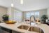 Apartment kitchen interior at Seasons at Plainfield Apartments in Plainfield, Illinois.
