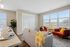 Apartment living room interior at Seasons at Plainfield Apartments in Plainfield, Illinois.
