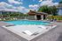 Resort-style swimming pool with lounge seating at Echelon at Charlotte