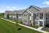 Modern apartment building exterior at Seasons at River View Apartments in Pleasant Prairie, Wisconsin.