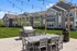 Luxury apartment grilling station and pergola with outdoor seating at Seasons at River View Apartments in Pleasant Prairie, Wisconsin.