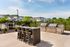 Outdoor grilling station and dining patio at Seasons at Franklin luxury apartments in Franklin, Wisconsin.