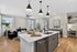 an island, bright cabinetry and contemporary finishes. Modern kitchen at Echelon at Cary apartments