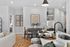 an island, bright cabinetry and contemporary finishes. Modern kitchen at Echelon at Cary apartments