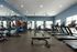 Fitness center at Seasons at North Aurora Apartments.