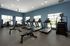 Fitness center at Seasons at North Aurora Apartments.