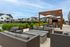 Outdoor lounge area at Seasons at North Aurora Apartments.