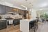 Elegant open-concept kitchen and dining area with modern cabinetry, sleek countertops, and inviting natural light.