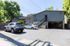 Inviting apartment exterior with ample parking and lush greenery in a serene neighborhood.