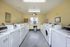 Bright and spacious community laundry room featuring modern washers, dryers  convenient and pleasant laundry experience.