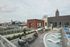 Luxurious urban rooftop terrace with city skyline views, lounge chairs, and modern seating areas.