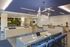 Contemporary office lobby with modern design, featuring a collaborative seating area and stylish decor.