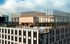 Luxurious rooftop pool and lounge area with panoramic city views, featuring modern architecture and inviting relaxation spaces.