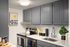 Charming modern kitchen with stylish gray cabinets, sleek stainless steel appliances, and elegant decor.