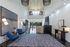 Modern apartment lobby with stylish seating, contemporary lighting, and spacious open layout.