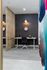 Modern home office space with sleek desk, comfortable chair, and stylish decor, ideal for productivity.