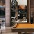 Chic entertainment space with a modern bar, elegant pool table, and artistic wall accents, perfect for social gatherings.