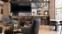 Elegant communal lounge with modern seating, stylish bar area, and chic d&eacute;cor, perfect for social gatherings.