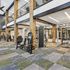 Modern fitness center with state-of-the-art gym equipment, high ceilings, and stylish flooring.