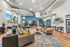 Vibrant and spacious modern living room with stylish decor, abundant natural light, and contemporary furnishings, offering a welcoming atmosphere.