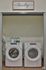 Modern laundry room featuring sleek Whirlpool washer and dryer set with stylish storage above.