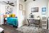 Bright and modern bedroom with a cozy bed, stylish desk space, and chic decor, ideal for productivity and relaxation.