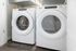 Modern laundry nook with sleek Whirlpool washer and dryer, maximizing efficiency and style.