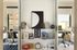Modern student room with a stylish bookshelf display, featuring cozy workspaces in a bright and airy environment.