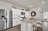 Nautical Point at Lakeshore Villages kitchen with counter seating and backyard view - Slidell, LA