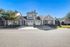 Charming townhouse with dual garages and a welcoming front porch set in a serene neighborhood.