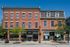 Charming historic downtown brick building with vibrant storefronts