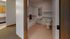 Inviting bathroom with modern fixtures and convenient access to the kitchen area, showcasing versatile living space.